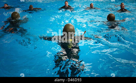 US Marine students perform rescue drills during Marine Corps Swim Instructor Course March 5, 2013 at Marine Corps Base Camp Lejeune, NC. Stock Photo