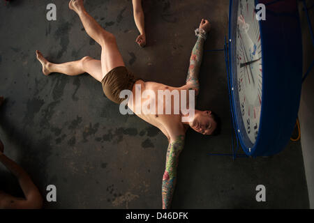 Sgt. Luke Vucsko, Marine Corps Security Forces Training Company, stretches before the Marine Corps Swim Instructor Course March 5, 2013 at Marine Corps Base Camp Lejeune, NC. Stock Photo