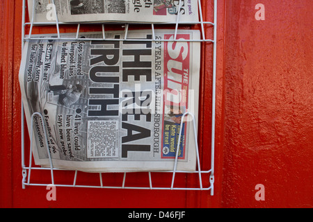 Newsagent rack showing front page of The Sun with 'The Real Truth' headline about Hillsborough Inquiry, 13th September 2012. Stock Photo