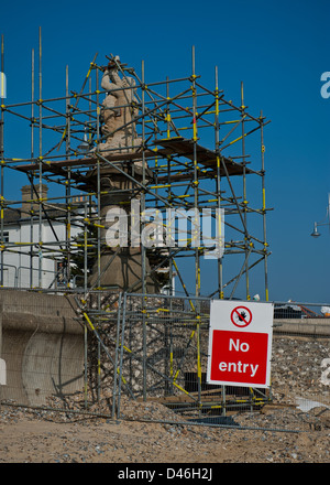 Statue on Lowestoft seafront undertaking urgent repair. No entry sign to beach. No public access. Stock Photo