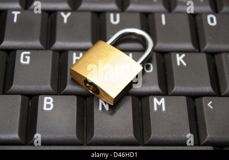 Padlock on laptop keyboard  Stock Photo