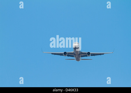 Airplane in the air coming to landing Stock Photo