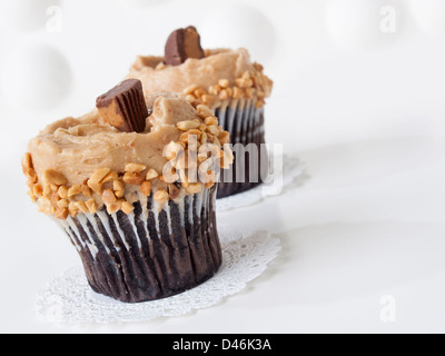 Gourmet Reese's peanut butter cups cupcake on white backround. Stock Photo