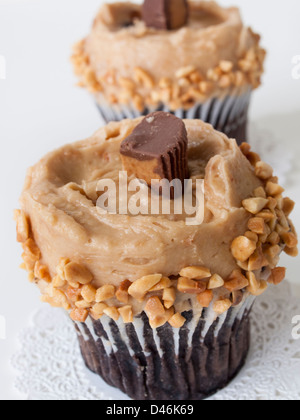 Gourmet Reese's peanut butter cups cupcake on white backround. Stock Photo