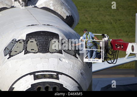 Technician Uncover Endeavour Windows (KSC-2012-5265) Stock Photo