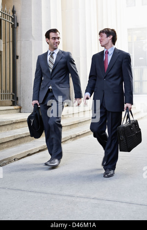 two wall street men going on their daily business routine Stock Photo