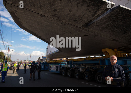 Space Shuttle Endeavour is transported overland through Los Angeles on ...