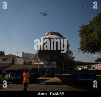 Space Shuttle Endeavour is transported overland through Los Angeles on ...