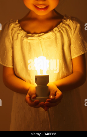 Girl Holding a Light Stock Photo