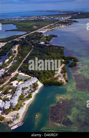 An aerial view of Islamorada, Florida, USA, midway in the Florida Keys along the Overseas Highway, shows Florida Bay (r.) and the Atlantic Ocean (l.). Stock Photo
