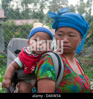 Mother carrying baby in Nepal Stock Photo