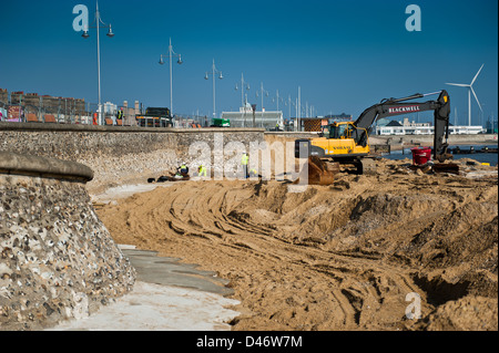 Repair work being carried out on the seawall at Lowestoft's south beach. Gulliver shown in the background. Stock Photo