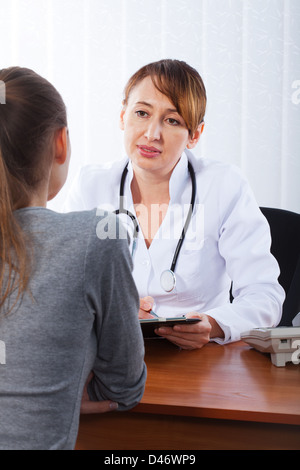 Doctor with female patient Stock Photo