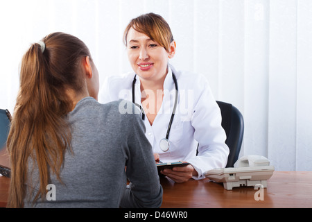Doctor with female patient Stock Photo