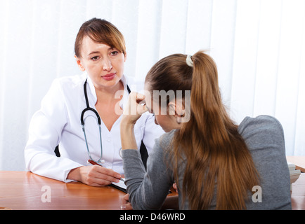 Doctor with female patient Stock Photo