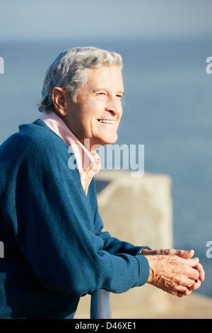 Happy senior man looking at sky with HOPE and FAITH. A middle-age ...