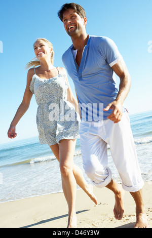 Couple Enjoying Romantic Beach Holiday Stock Photo