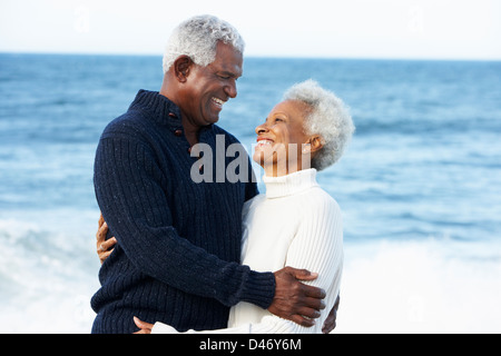 Romantic Senior Couple Hugging On Beach Stock Photo
