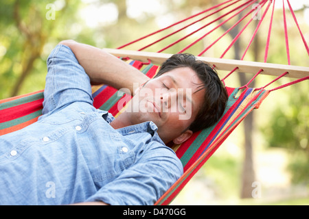 Man Relaxing In Hammock