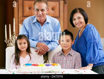 Grandparents Celebrating Children's Birthday Stock Photo