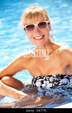 Senior Woman Having Fun In Swimming Pool Stock Photo