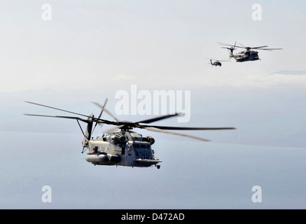 US Marine Corps CH-53 Super Stallion helicopters position to refuel from an Air Force MC-130P Combat Shadow aircraft during a mission January 29, 2013 over Djibouti. Stock Photo