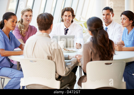 Medical Team Discussing Treatment Options With Patients Stock Photo