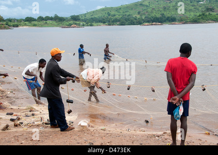 Central African Republic. August 2012. Bangui. Men with fishing nets on the bank of the Ubangi river Stock Photo