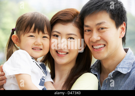 Portrait Of Chinese Family With Daughter In Park Stock Photo