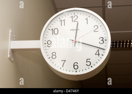 A traditional wall-mounted hospital clock. Stock Photo