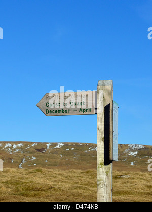 'Coast to Coast December - April', public bridleway fingerpost. Nateby Fell, Lake District National Park, Cumbria, England, U.K. Stock Photo