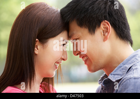 Portrait Of Young Chinese Couple Looking At Each Other Stock Photo