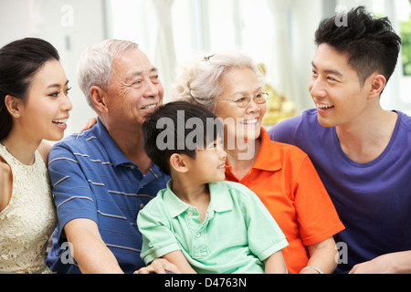 Portrait Of Multi-Generation Chinese Family Relaxing At Home Together Stock Photo