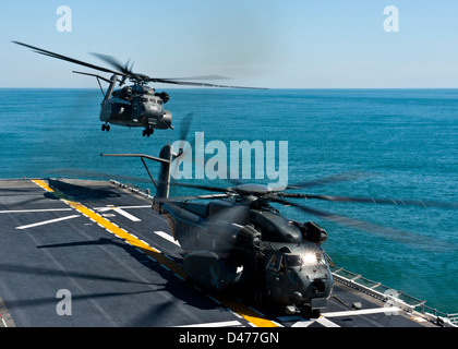 MH-53E Sea Dragon helicopters take off from USS Wasp Stock Photo