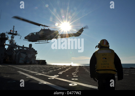 A Sailor watches flight ops. Stock Photo