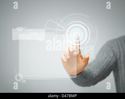 man pressing virtual button Stock Photo