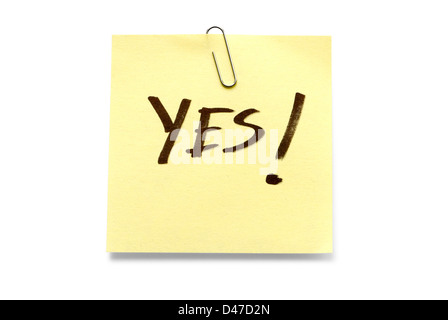 Adhesive note with 'Yes' written across it Stock Photo