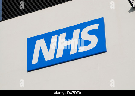 NHS sign and logo on the side of a health centre Stock Photo - Alamy