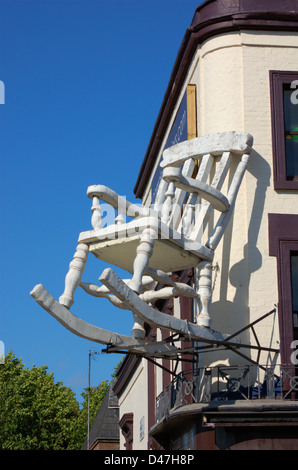 Large rocking chair on a shop front in Camden, London, England Stock Photo