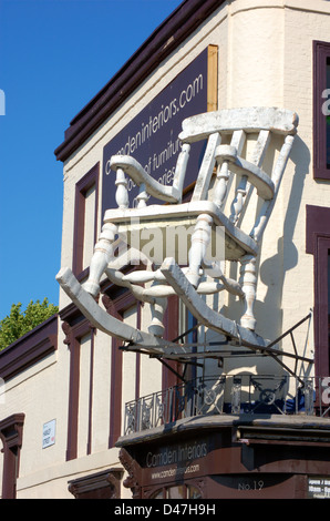 Large rocking chair on a shop front in Camden, London, England Stock Photo