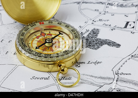 A brass compass on an old map - (map drawn by photographer and is copyright free) Stock Photo