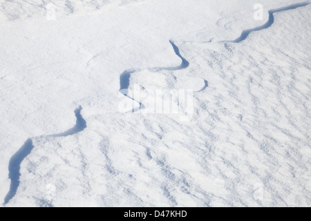 Texture of snowdrift with nice curved shadows Stock Photo