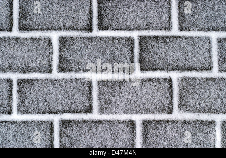 Brick road with snow Stock Photo