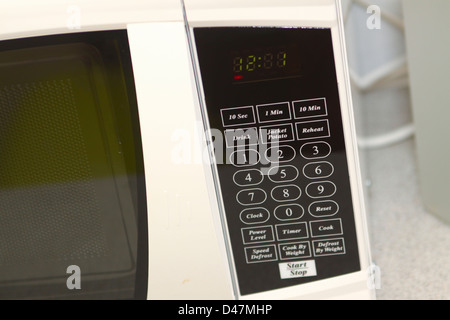 Digital control panel on microwave oven Stock Photo