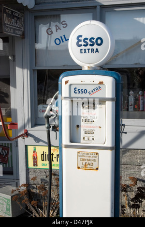 Vintage Esso gas pump in blue paint trim, classic roadside Americana from the 1960's. Stock Photo