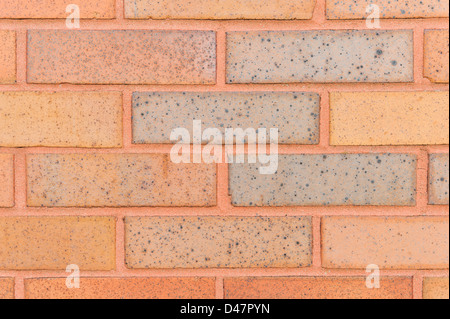 Brick wall background in orange red for a design element, close up. Stock Photo