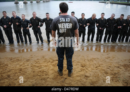 An upperclass midshipman gives a briefing to first-year midshipmen. Stock Photo
