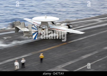 A Hawkeye launches from the USS Dwight D. Eisenhower. Stock Photo