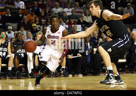 Butler center Andrew Smith (44) puts up a go-ahead score against Pittsburgh  guard Ashton Gibbs (12) with only seconds remaining in a third-round game  of the 2011 NCAA Men's Basketball Championship tournament