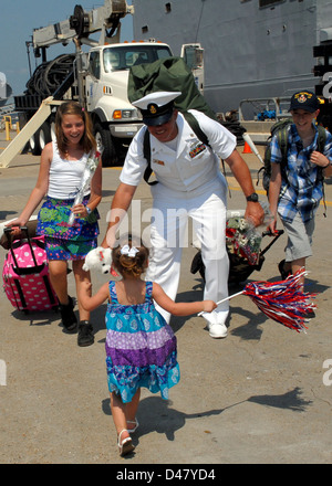 A Sailor greets his family. Stock Photo